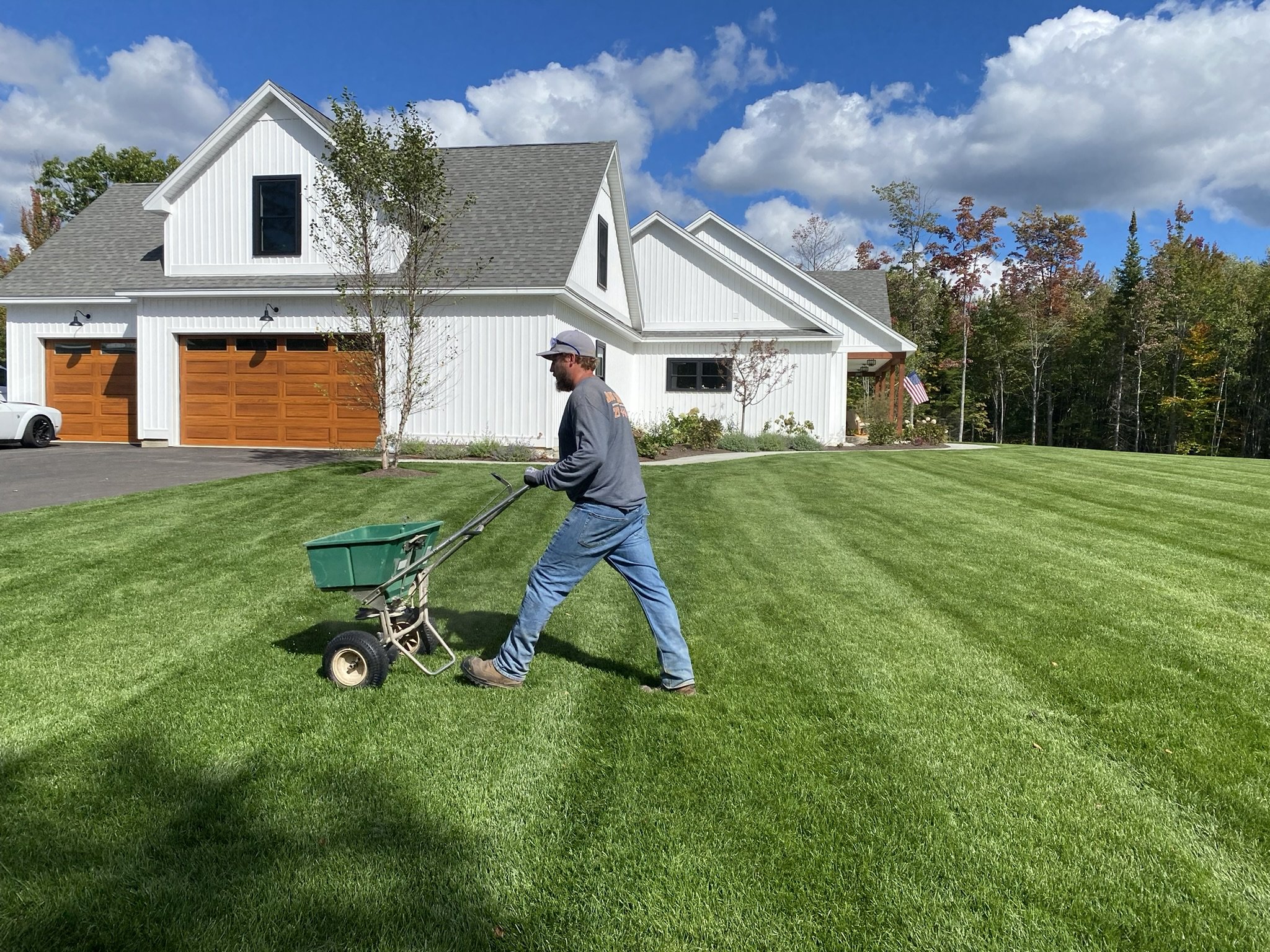 https://justgrassinc.com/wp-content/uploads/2025/04/SoilAmendmentPushSpreader.jpeg